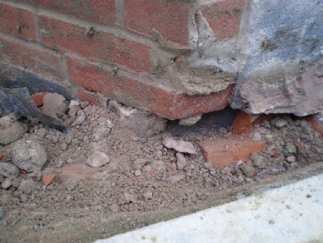 Brickwork supported on foundations?  They didn't even try to hide it!